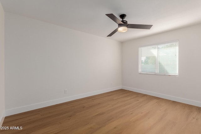 empty room with light hardwood / wood-style flooring and ceiling fan