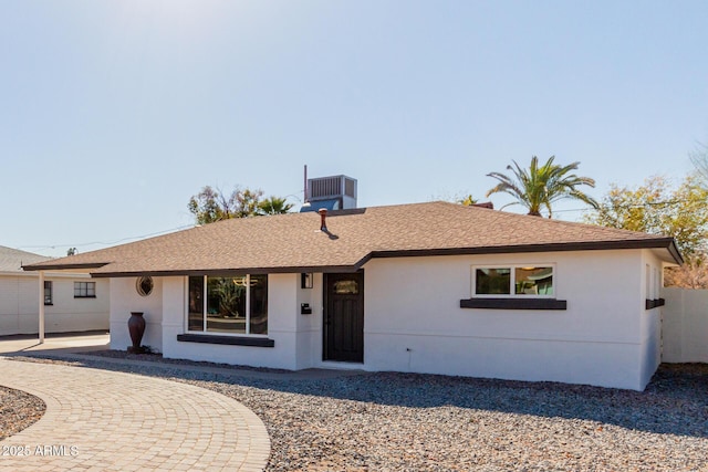 ranch-style home featuring cooling unit