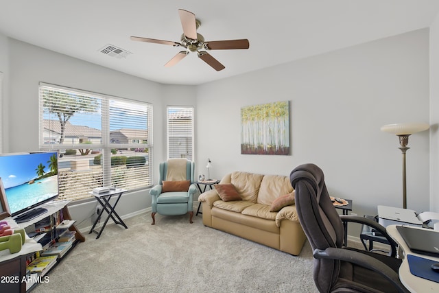 office area with a ceiling fan, visible vents, carpet floors, and baseboards