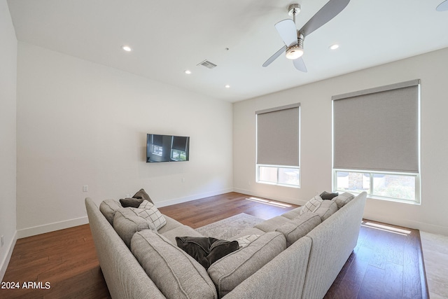 living room featuring a healthy amount of sunlight, wood-type flooring, and ceiling fan