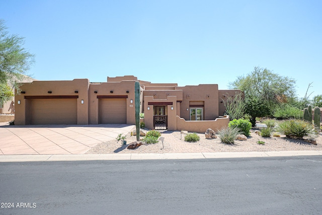 southwest-style home with a garage