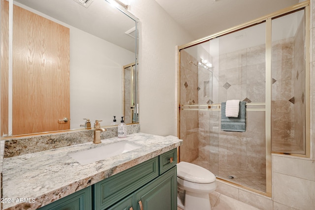 bathroom with vanity, toilet, and walk in shower