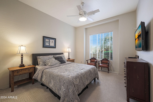 bedroom with ceiling fan and carpet floors