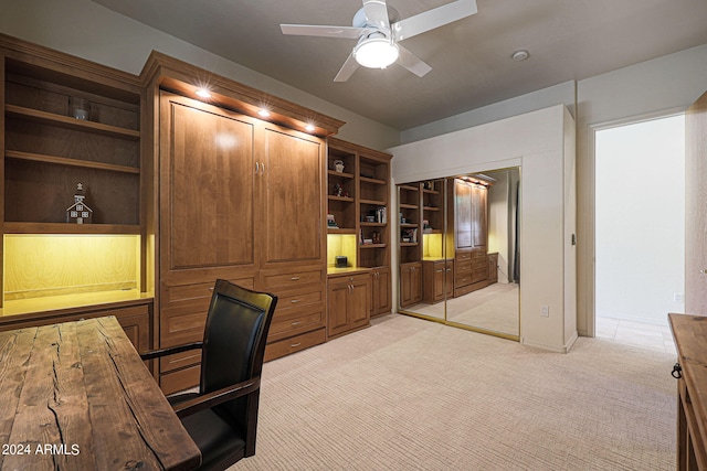 unfurnished office with light colored carpet and ceiling fan