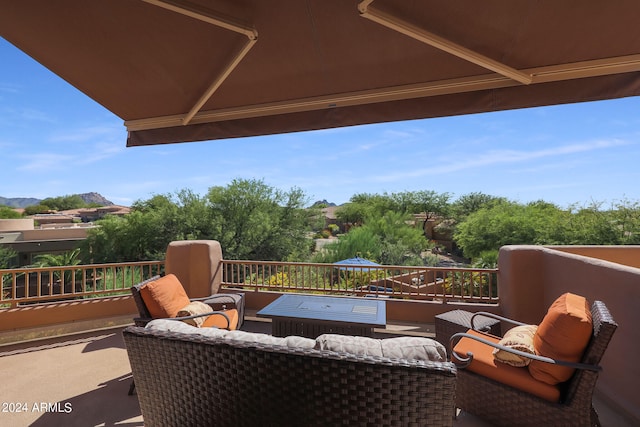 view of patio / terrace with an outdoor living space and a balcony