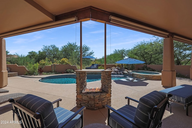 view of swimming pool featuring a patio and an in ground hot tub