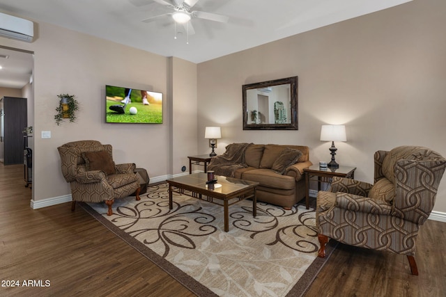 living room featuring wood-type flooring, a wall unit AC, and ceiling fan