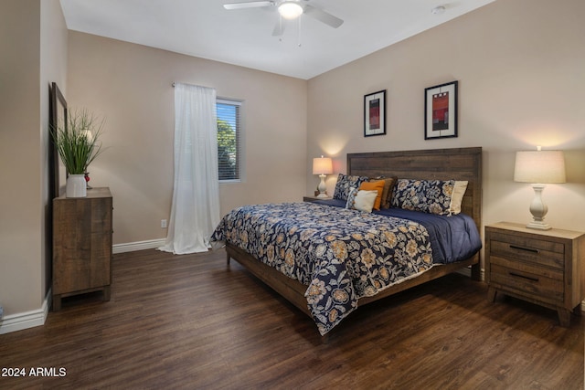 bedroom featuring ceiling fan and dark wood-type flooring