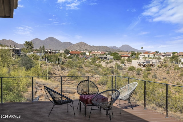 wooden terrace featuring a mountain view