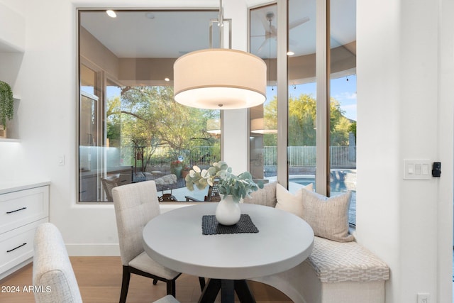 dining space with light wood-type flooring