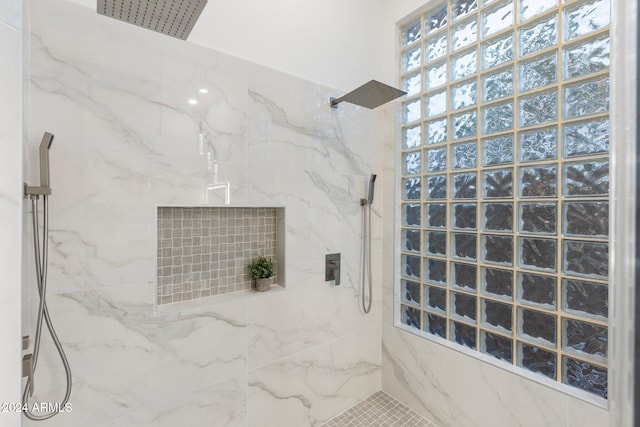 bathroom with tiled shower