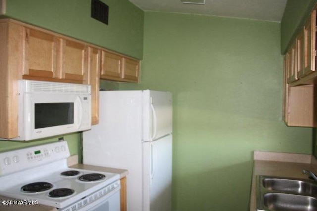 3301 E Earll Dr Unit 219, Phoenix, AZ 85018 - kitchen featuring white appliances and a sink