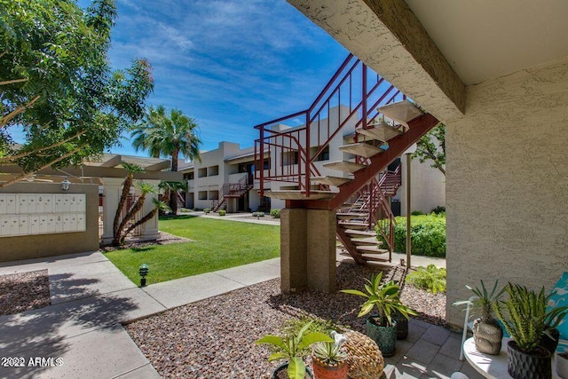 3301 E Earll Dr Unit 219, Phoenix, AZ 85018 - view of green lawn featuring stairway and mail area