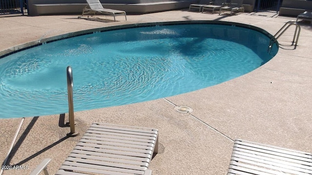 3301 E Earll Dr Unit 219, Phoenix, AZ 85018 - community pool with a patio