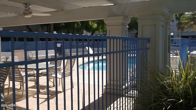 3301 E Earll Dr Unit 219, Phoenix, AZ 85018 - gate featuring a patio, a ceiling fan, and a community pool