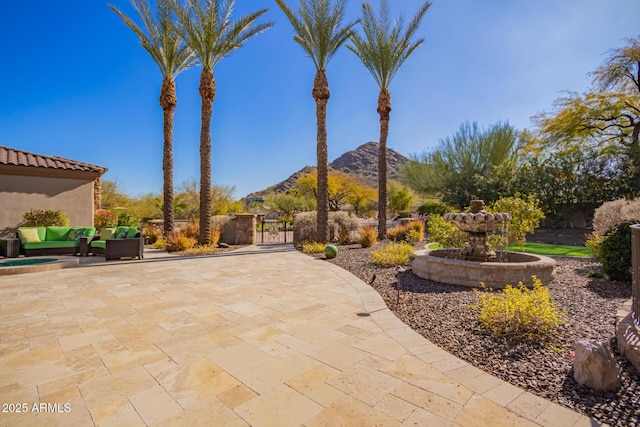 view of patio with a mountain view and an outdoor hangout area