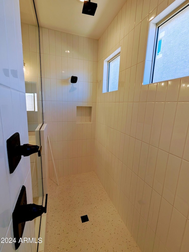 bathroom with tiled shower