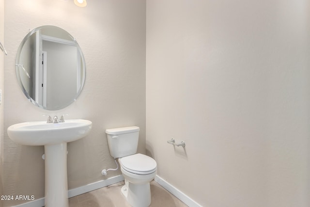 bathroom with toilet and sink