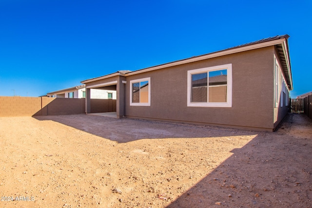 rear view of property featuring a patio area