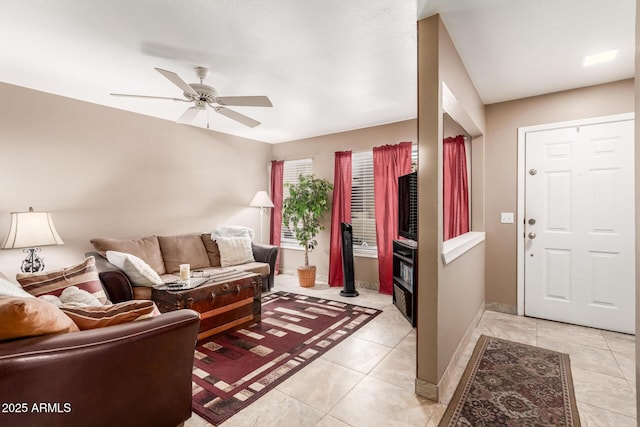 tiled living room featuring ceiling fan