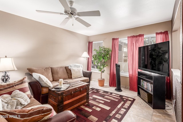 tiled living room with ceiling fan