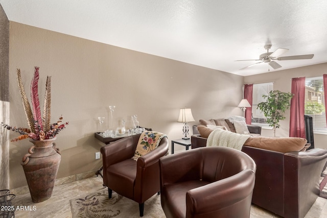 living room featuring ceiling fan