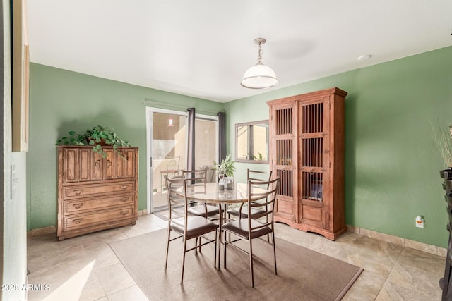 dining space with light tile patterned floors