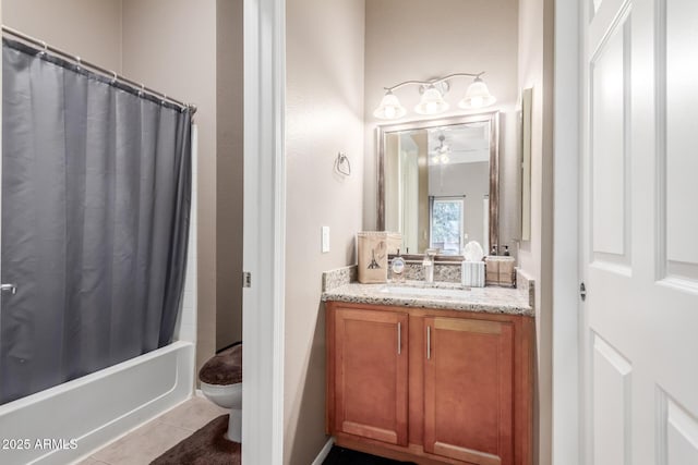 full bathroom with toilet, ceiling fan, tile patterned floors, shower / tub combo, and vanity