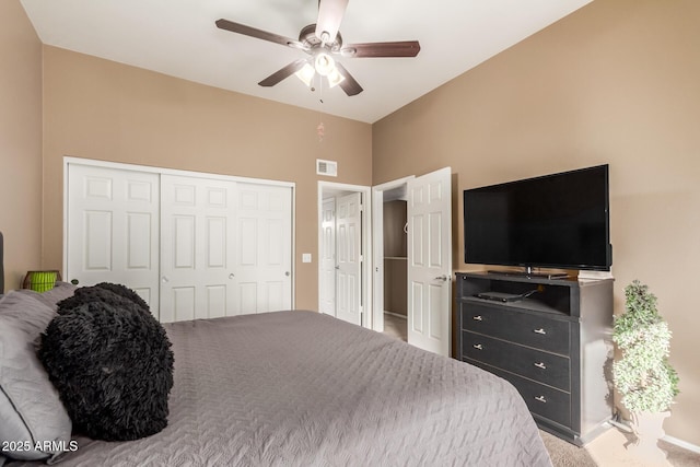 bedroom featuring a closet, ceiling fan, and carpet floors