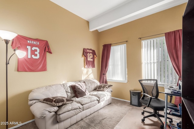 carpeted home office featuring a wealth of natural light and beam ceiling