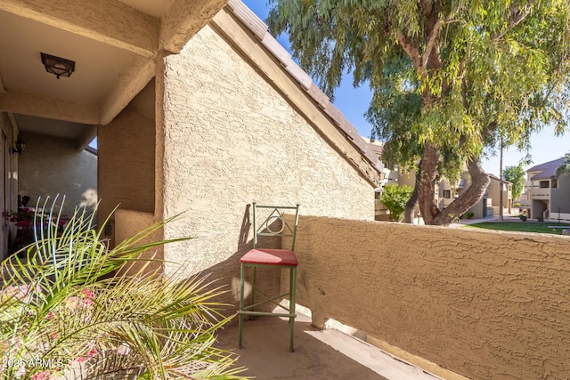 view of side of home with a balcony