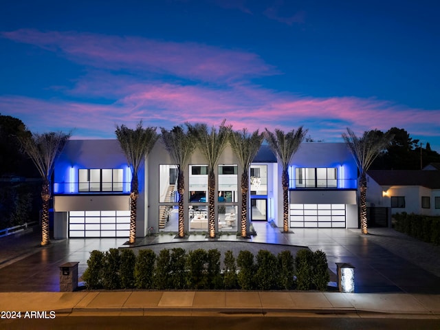 contemporary house with a balcony and a garage