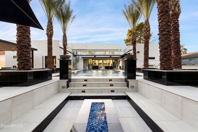 view of patio / terrace featuring a jacuzzi