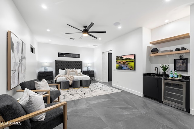 bedroom with ceiling fan, wine cooler, and wet bar