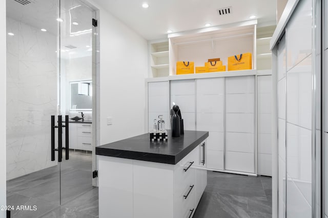 kitchen featuring white cabinets