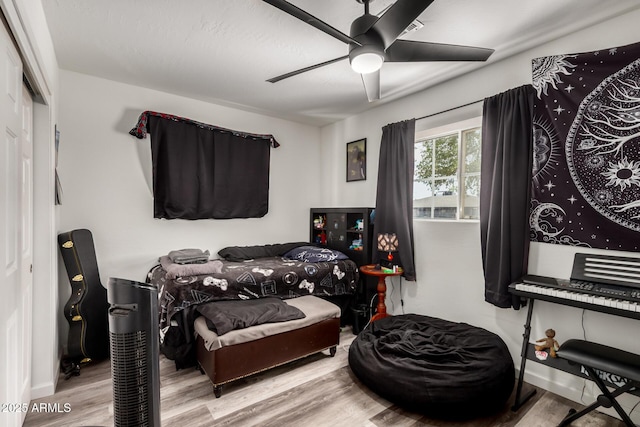 11132 W Indiana Ave, Youngtown, AZ 85363 - bedroom featuring wood finished floors and a ceiling fan