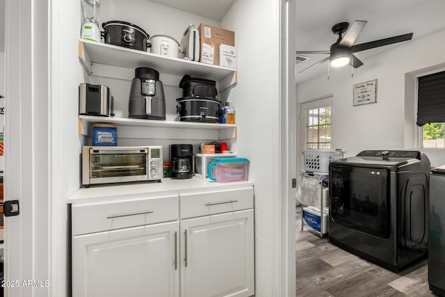 11132 W Indiana Ave, Youngtown, AZ 85363 - laundry area featuring ceiling fan, wood finished floors, plenty of natural light, and washing machine and clothes dryer