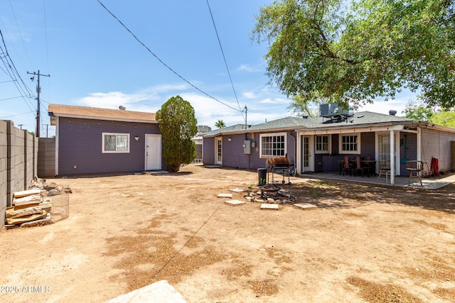 11132 W Indiana Ave, Youngtown, AZ 85363 - back of property featuring a patio, an outbuilding, and central air condition unit