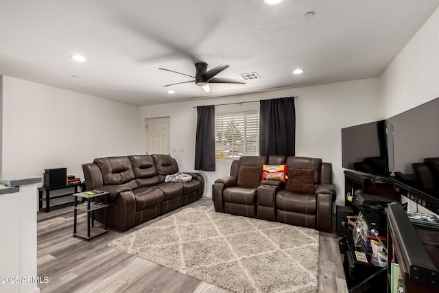 11132 W Indiana Ave, Youngtown, AZ 85363 - living room featuring wood finished floors, a ceiling fan, and recessed lighting