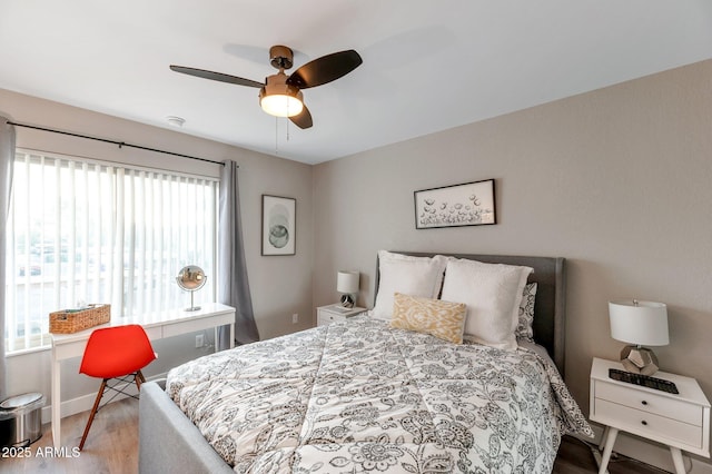 bedroom featuring hardwood / wood-style floors and ceiling fan