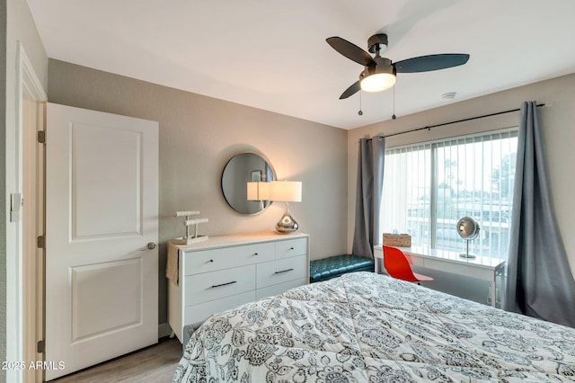 bedroom featuring light hardwood / wood-style floors and ceiling fan