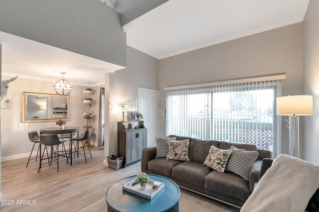 living room with a chandelier and wood-type flooring