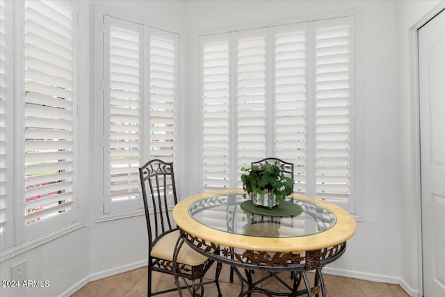 dining space with light tile patterned floors