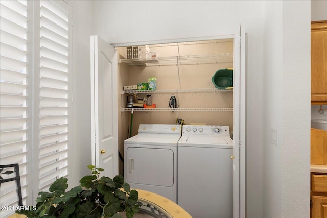 laundry area with washing machine and dryer