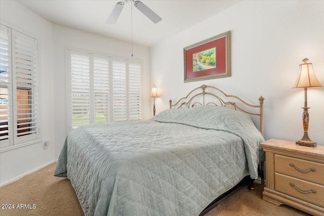 bedroom with light colored carpet and ceiling fan