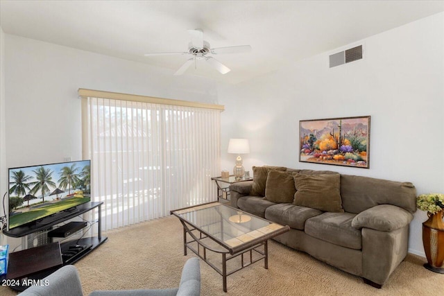 living room with ceiling fan and light colored carpet