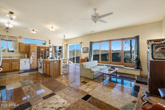 living area featuring a ceiling fan