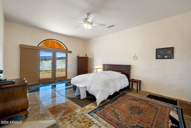 bedroom with access to exterior, visible vents, and ceiling fan