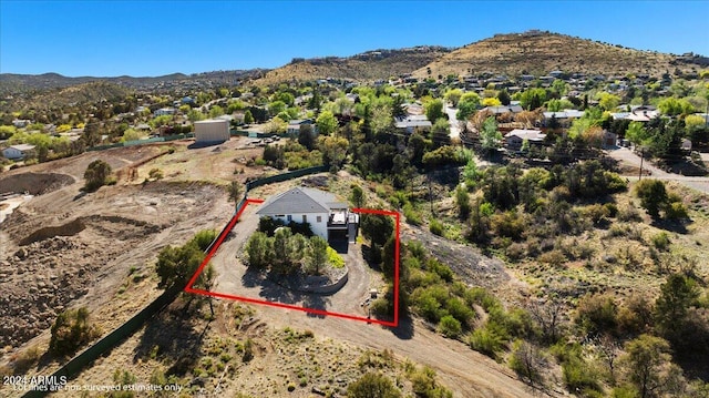 birds eye view of property featuring a mountain view