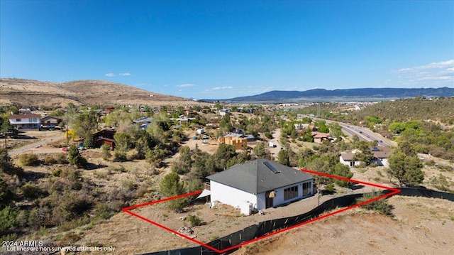 birds eye view of property with a mountain view